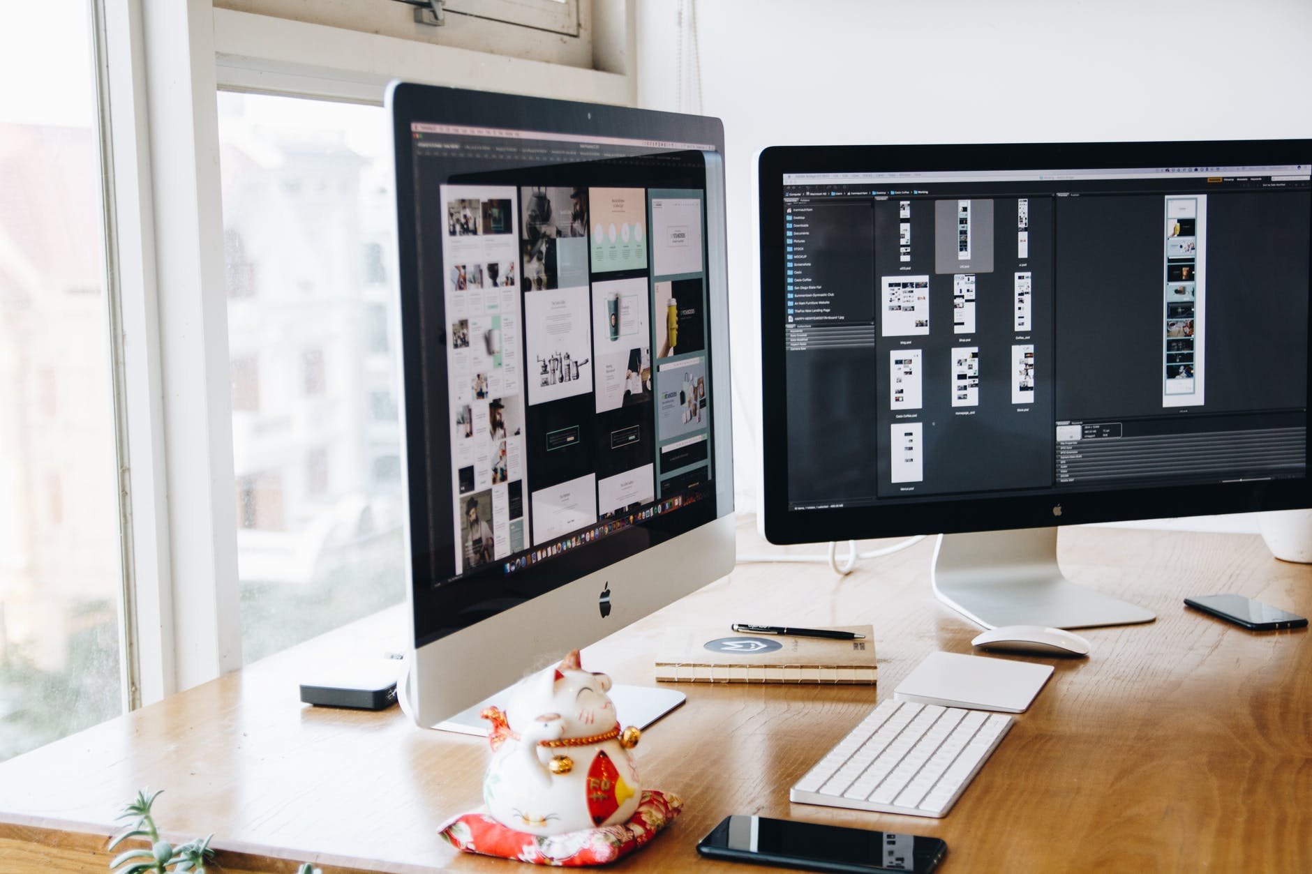 silver imac on top of brown wooden table